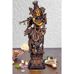 Krishna brass showpiece with detailed crown and ornaments, standing on ornate base