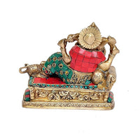 Ganpati Ganesha brass statue, rear view with red garment, teal patterned attire, book resting