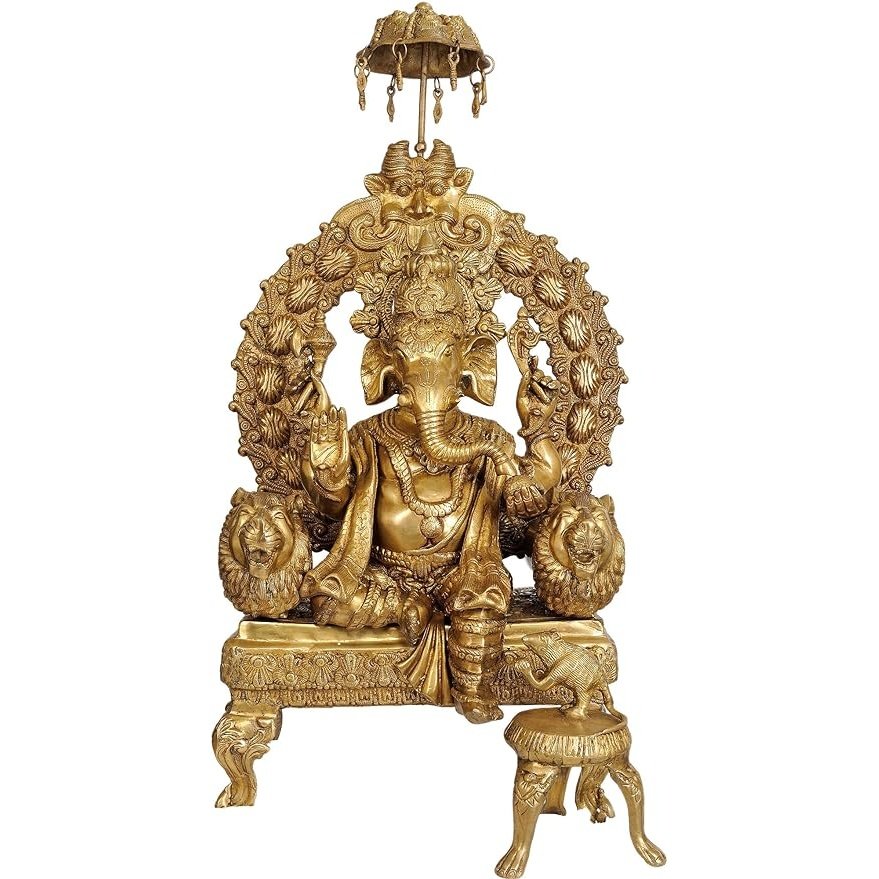 Brass Lord Ganesha figurine, seated with ornate headdress and decorative halo