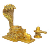 Gold brass Shiv linga with Nandi and small side lamp holder, angled side view