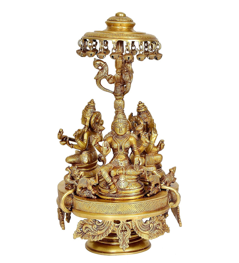 Brass Lakshmi, Ganesha and Saraswati Seated on Rotating Chowki with Parasol Idol (Height: 14 Inch)