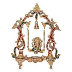 Brass Ganesha swing statue with colorful red and green accents, hanging bell and chains