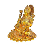 Brass Lakshmi idol statue in profile, seated on lotus with detailed golden ornaments