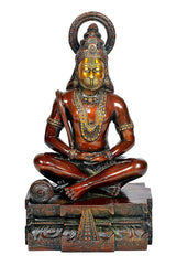Bronze-toned Hanuman yoga pose idol statue with crown, seated on decorated pedestal