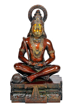 Bronze-toned Hanuman yoga pose idol statue with crown, seated on decorated pedestal