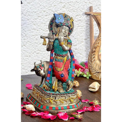 Brass Krishna statue with cow, painted blue turban and red dhoti, 9.6 in