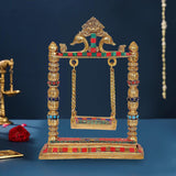 Brass swing jhula with decorated pillars, painted strings and seat for Ladoo Gopal