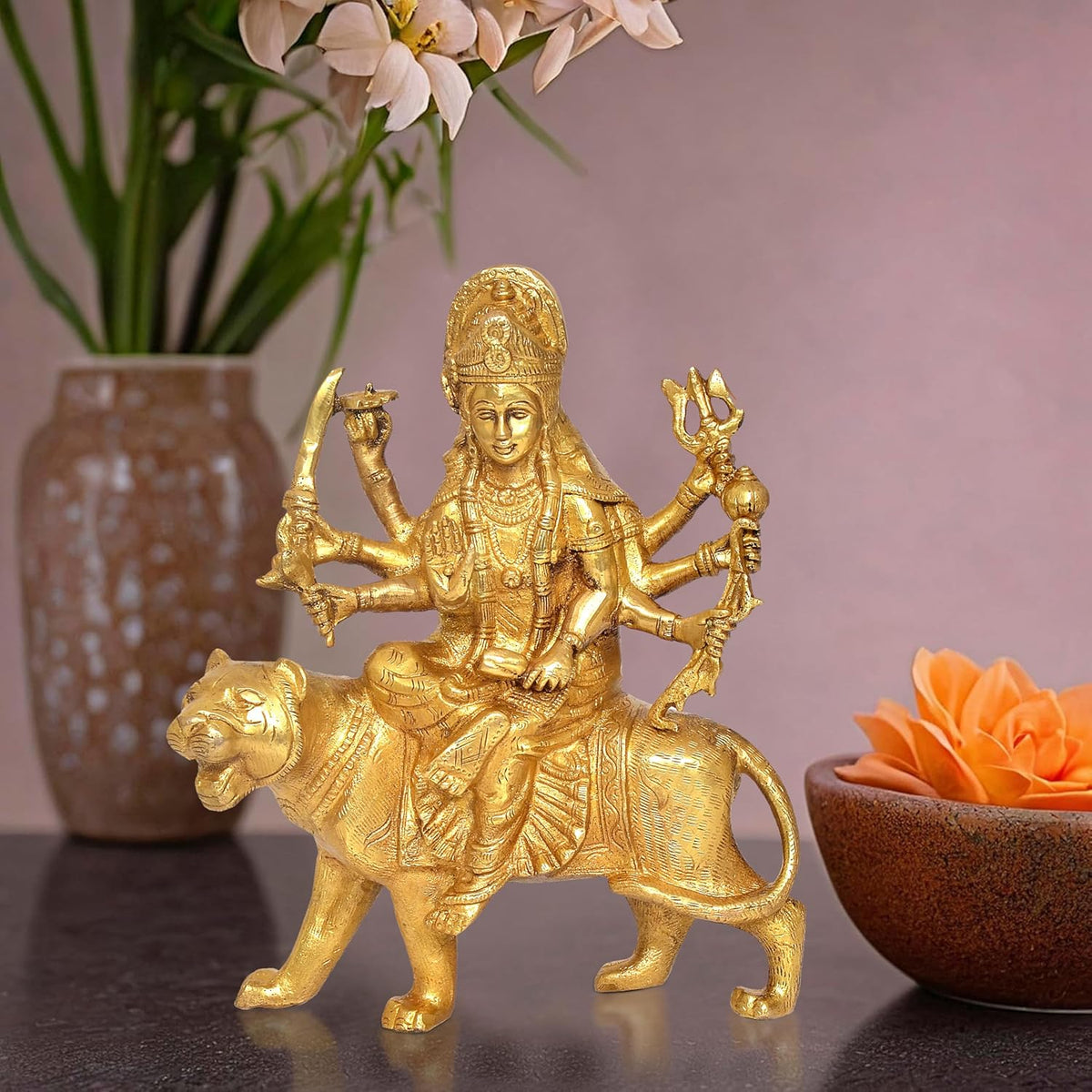 Gold brass Durga Maa idol on lion, eight arms holding weapons, 8-inch height