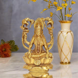 Brass Lakshmi idol seated on lotus with four elephant trunk arms, puja decor