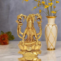 Brass Lakshmi idol seated on lotus with four elephant trunk arms, puja decor