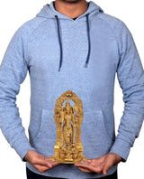 Brass Vishnu statue held in hands, standing four-armed figure on base