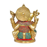 Rear 7-inch brass Ganesha statue with jeweled skirt and red, blue, turquoise patterns