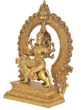 Brass Durga maa idol, profile view showing multi-armed goddess and lion in carved arch