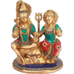 Brass Shiva-Parvati seated statue with trident on circular base, turquoise and red details