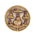 Brass Buddha plate idol with central seated Buddha, four side figures, halo frame