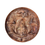 Back view of brass Buddha plate idol with textured patina, round wall hanging decor