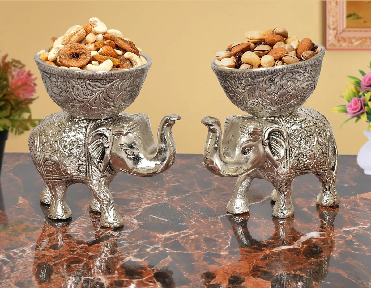 Silver elephant dry-fruit bowls, ornate metal showpiece, front pair with engraved bowls