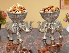 Silver elephant dry-fruit bowls, ornate metal showpiece, front pair with engraved bowls