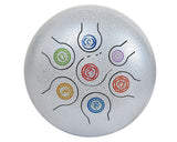 Silver steel happy drum top with six colored spiral symbols and black lines