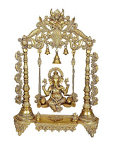Ornate brass Ganesha on swing with three small bells and decorative pillar supports