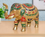 Brass elephant figurine, 10-inch height, gold-tone body with red, green, blue painted details