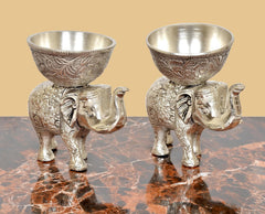 Silver elephant dry-fruit bowls, close front view of two engraved elephants with cup tops