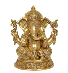 Golden brass Ganesha statue with detailed face, seated posture, raised hands