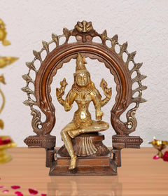 Brass Lakshmi idol statue with decorative arch, seated goddess with raised hands