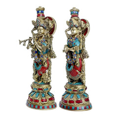 15-inch brass Radha Krishna idol set; side profiles with painted jewelry detailing