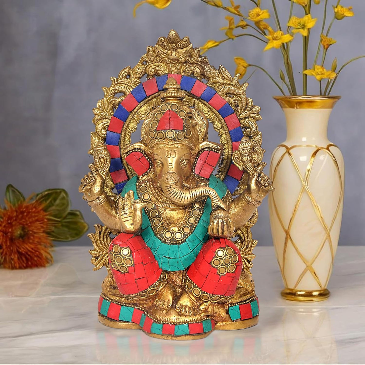 Brass Lord Ganesha statue with ornate crown, gold halo and colorful red-blue attire