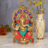 Brass Lord Ganesha statue with ornate crown, gold halo and colorful red-blue attire