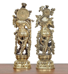 Brass Radha Krishna idol pair, rear view with circular halo designs and ornaments