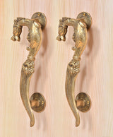 Brass yali design door handle pair, detailed curved levers with round base plates