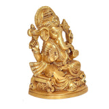 Brass Ganesh idol statue, side view, seated with four arms and ornate details