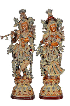 AONA Radha Krishna brass figurines with detailed crowns and ornaments, brown finish
