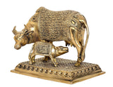 Brass cow and calf decor statue, side view with textured platform and engraved borders