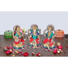 AONA Brass Lakshmi Ganesha Saraswati statue set, silver finish, seated with colorful details