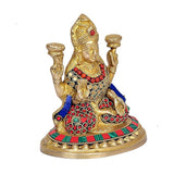 Maa Lakshmi brass idol side view, blue drape, red beadwork, gold crown