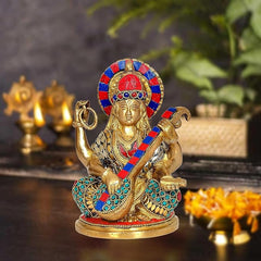 Brass Saraswati idol, 7 inch seated goddess holding book and staff, colorful crown
