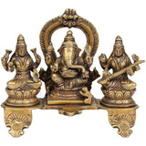 Brass triple deity idol: Lakshmi, Ganesha and Saraswati seated on lotus base