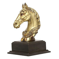 Gold-tone horse head sculpture on dark wooden base, angled view