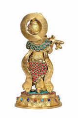 Brass Krishna figurine rear view, gold disc halo and jeweled robe, round base