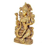 Brass Laxmi goddess figurine, side view seated on lotus base, detailed relief