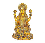 Golden brass Lakshmi idol statue, seated with crown and four arms raised