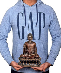 Buddha idol sculpture graphic on heather blue GAP hoodie held in hands