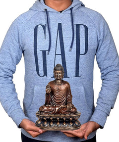 Buddha idol sculpture graphic on heather blue GAP hoodie held in hands