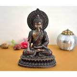 Resin Buddha sculpture, seated with ornate halo and blue-trimmed base, 11 in