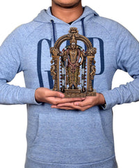 Model holding 8.5 inch resin Kartikeya statue, ornate arch and jeweled detailing