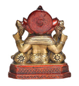 Back view of brass Lord Ganesha idol, red circular halo and gold details, 7 inch
