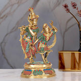 Dancing Radha-Krishna brass idol with red & green enamel detailing, ornate crowns